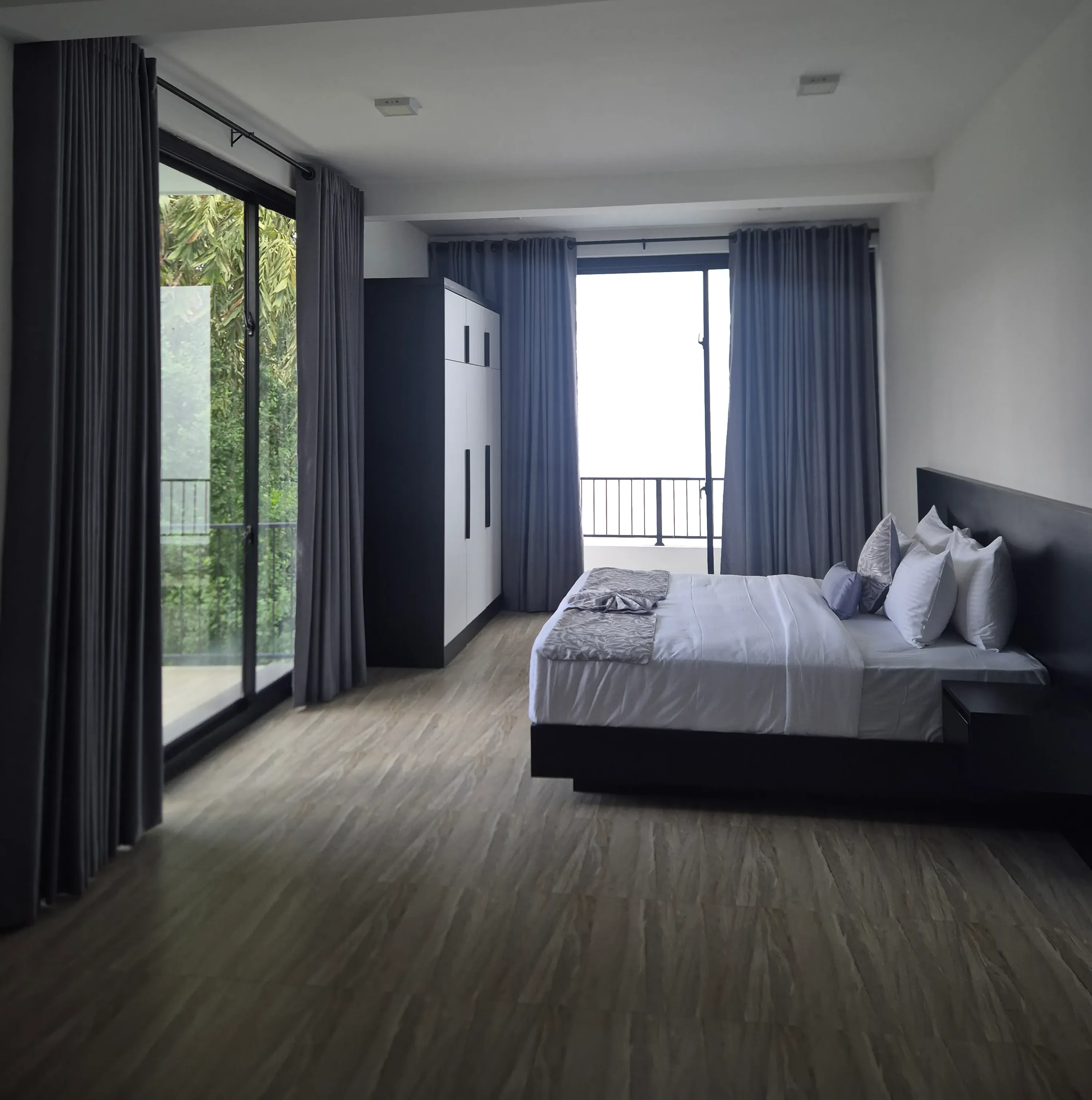 Master suite with modern amenities and natural light at TenTwo private villa Kandy